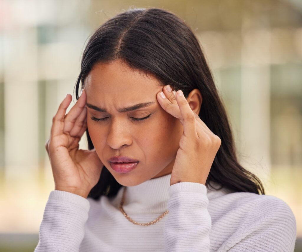 Woman suffers from migraine